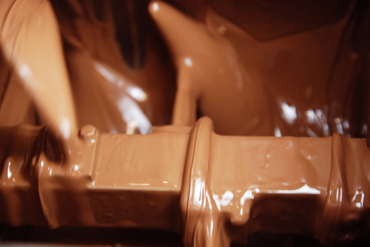 Liquid chocolate, during the conching process in the conche.