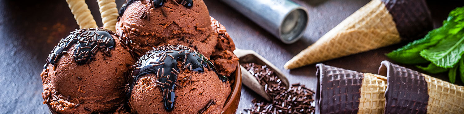Three scoops of chocolate ice cream and ice cream cones