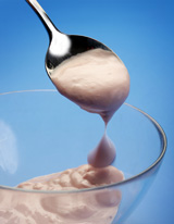 Lupin yoghurt in glass with spoon