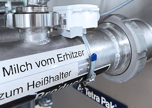  Image of a clip-on sensor for fouling monitoring on a pipe in a heat exchanger for dairy products