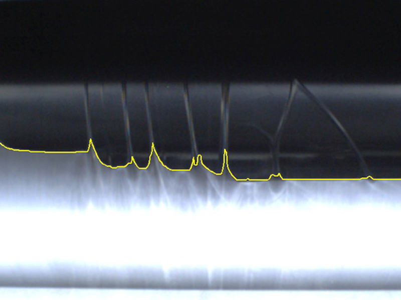 Trailing edge of a film with longitudinal folds, determined with the oWTP scanner