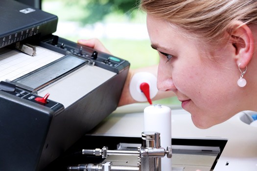 gas chromatograph Trained employee smells a heated outlet of the gas chromatograph