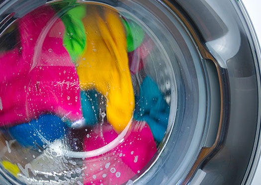Colored laundry when washing in the washing machine.